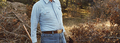 Ronald Reagan, cowboy hat, clearing brush.